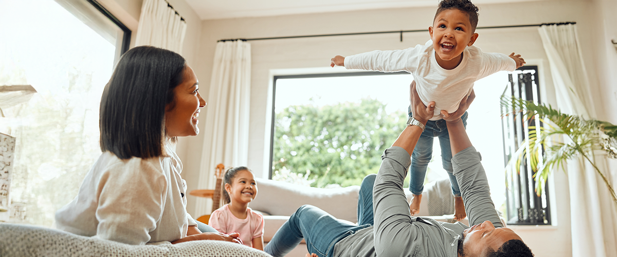 Family playing together indoors.